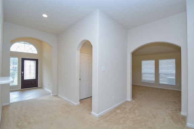 foyer with light colored carpet