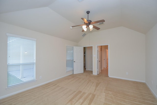 interior space featuring ceiling fan, plenty of natural light, and vaulted ceiling