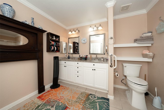 bathroom featuring tile patterned floors, vanity, toilet, and crown molding