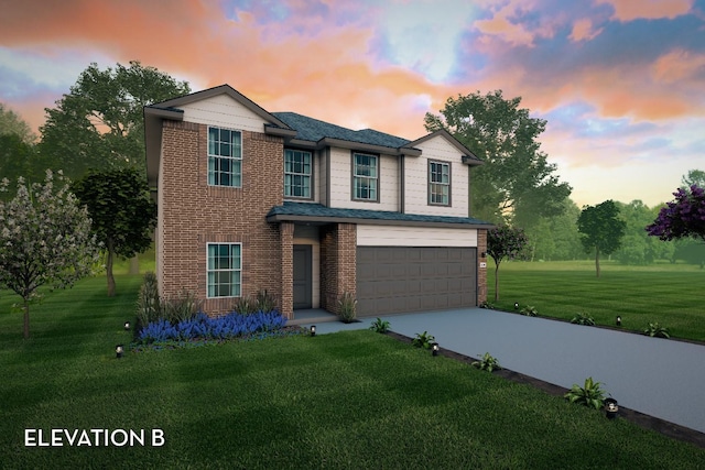 view of front of home with a lawn and a garage