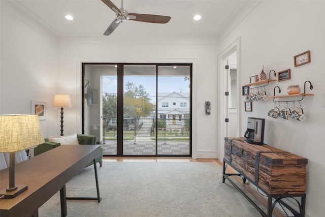 office space with ceiling fan and crown molding