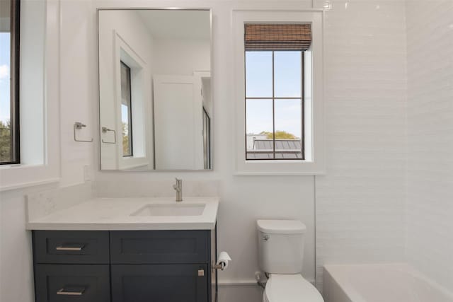 full bathroom featuring shower / bathing tub combination, vanity, and toilet