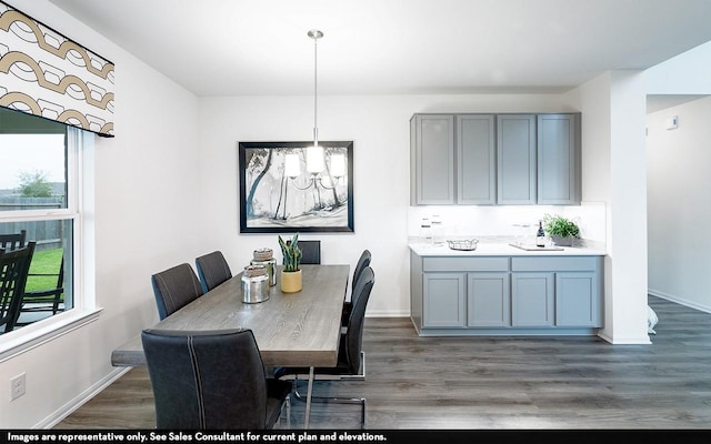 dining space with dark hardwood / wood-style floors