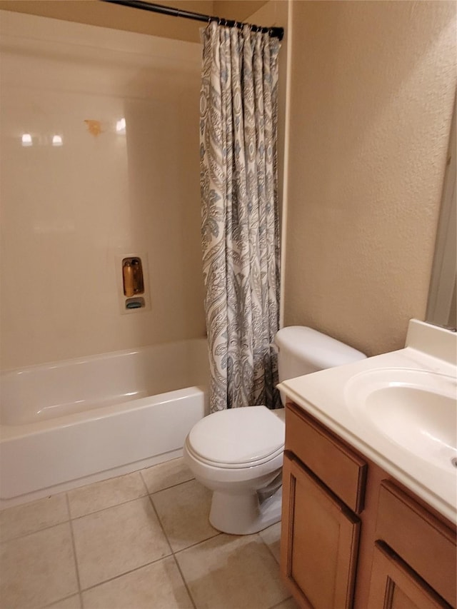 full bathroom with tile patterned flooring, vanity, toilet, and shower / bath combo with shower curtain