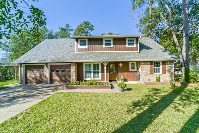 view of front of property featuring a front lawn and a garage