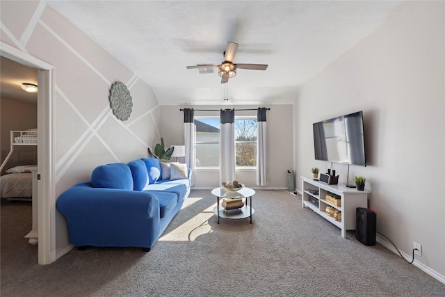 living room featuring lofted ceiling, ceiling fan, and carpet