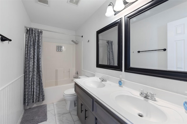 full bathroom featuring toilet, shower / bathtub combination with curtain, and vanity