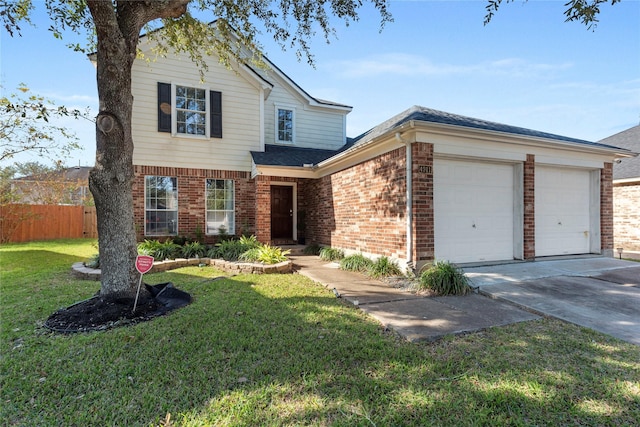 view of property featuring a garage and a front lawn