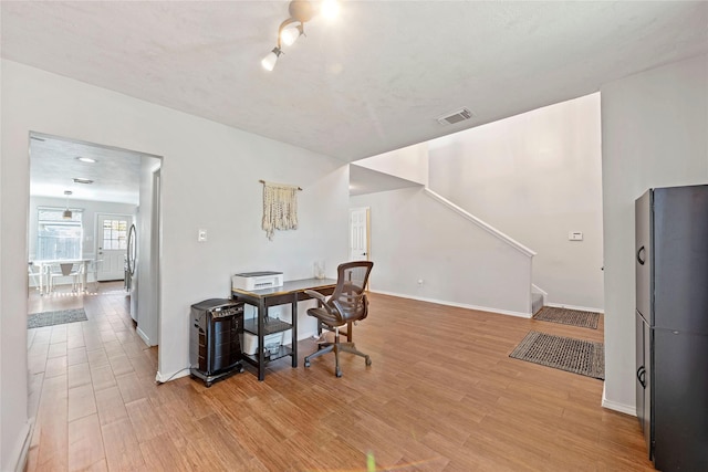 home office featuring light wood-type flooring