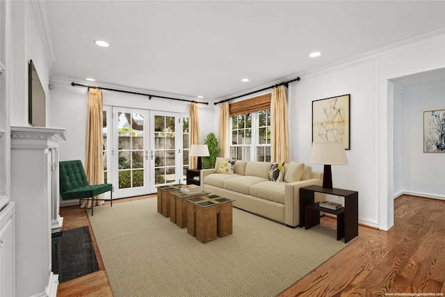 living room featuring french doors, hardwood / wood-style flooring, and ornamental molding