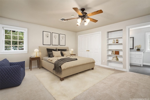 bedroom featuring ceiling fan, a closet, and carpet