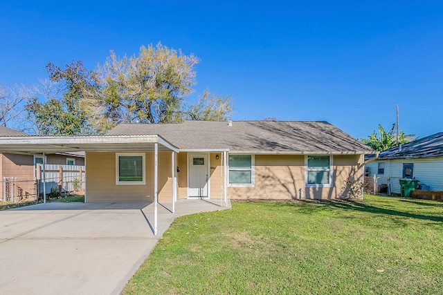 single story home with a carport and a front lawn