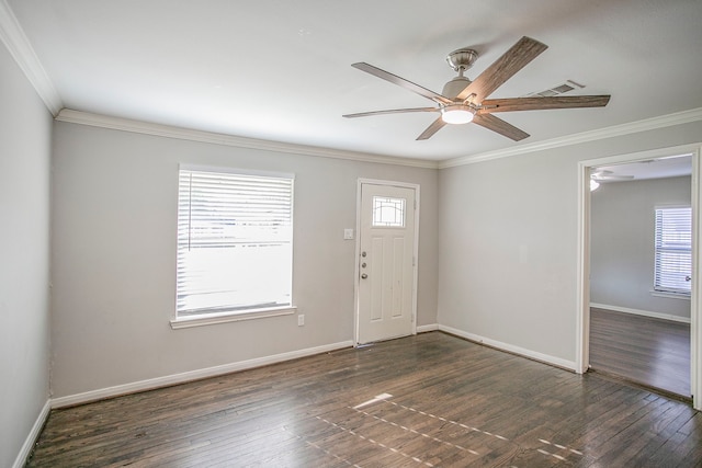 entrance foyer featuring a wealth of natural light and crown molding