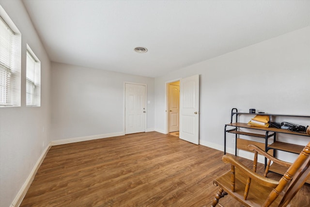 spare room with hardwood / wood-style flooring