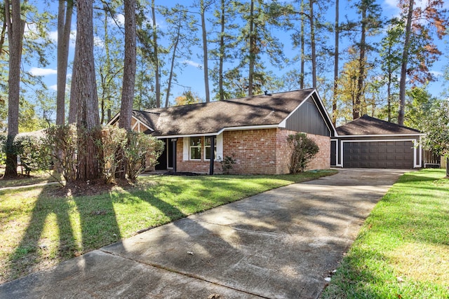 single story home featuring a front yard and a garage