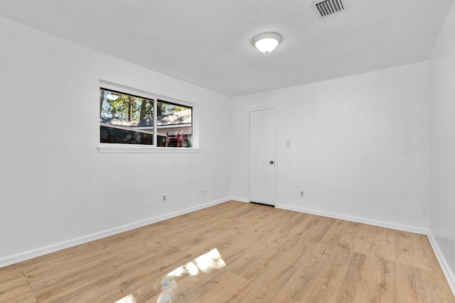 unfurnished room with light hardwood / wood-style flooring