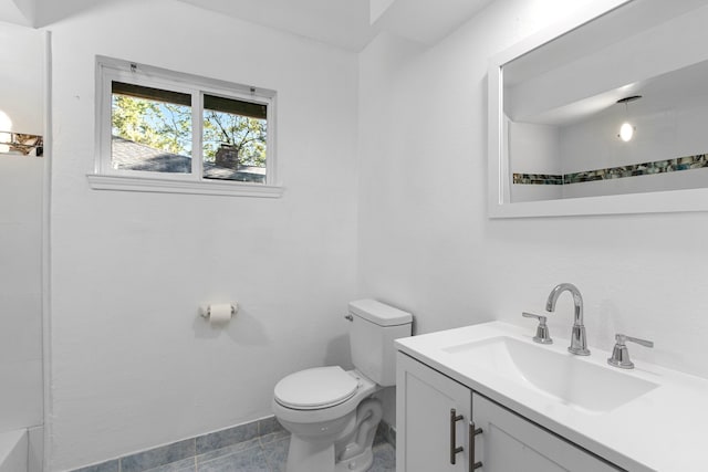 bathroom with vanity, toilet, and walk in shower