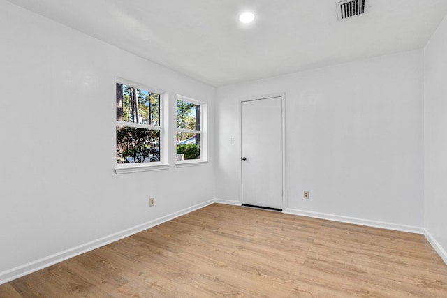 empty room with light hardwood / wood-style floors