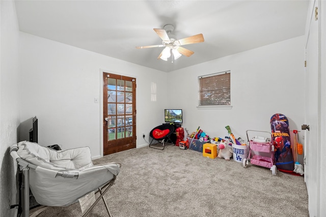 game room with ceiling fan and carpet flooring