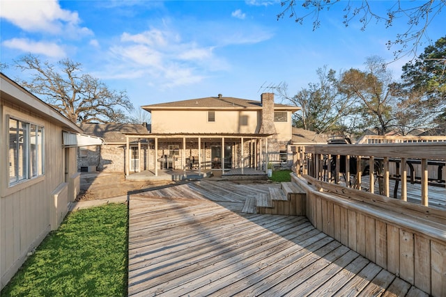 wooden terrace with a sunroom