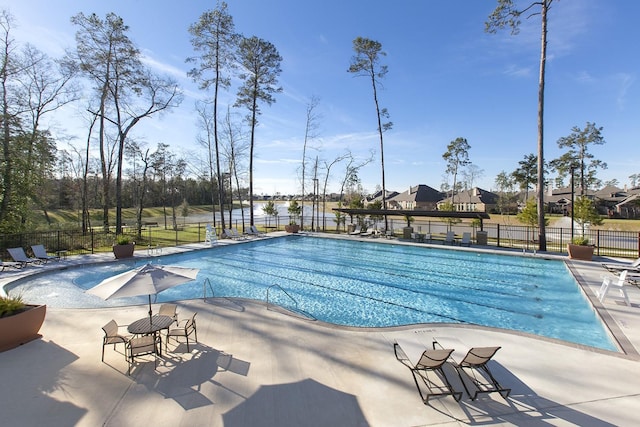 view of swimming pool with a patio area