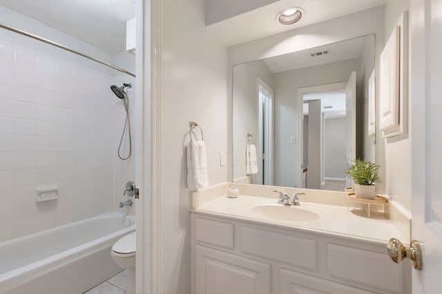 full bathroom with tile patterned floors, vanity, toilet, and tiled shower / bath