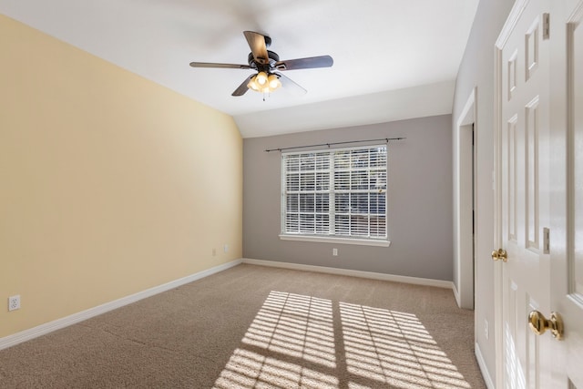 unfurnished room featuring light carpet, ceiling fan, and lofted ceiling