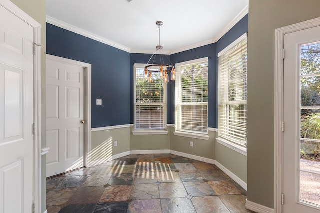 unfurnished dining area with ornamental molding and a notable chandelier