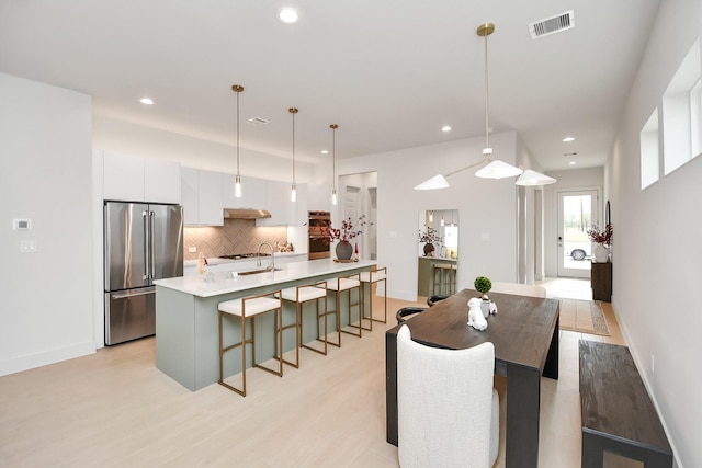 dining room with light hardwood / wood-style floors