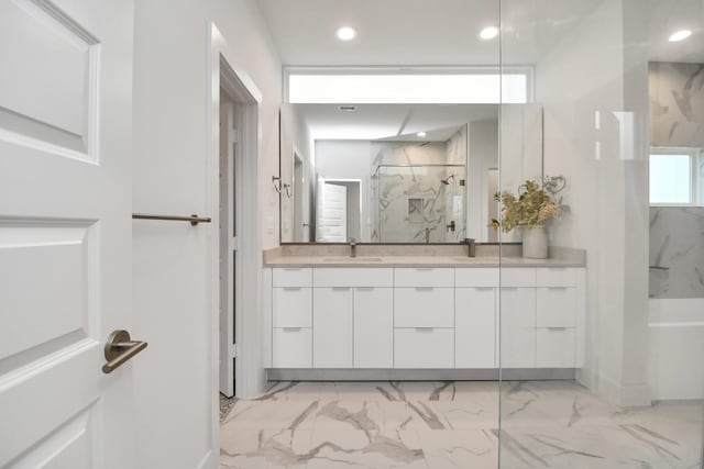 bathroom with vanity and walk in shower