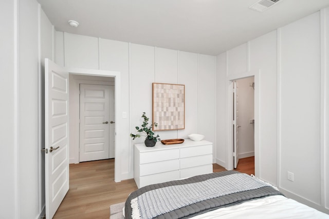 bedroom with light hardwood / wood-style flooring