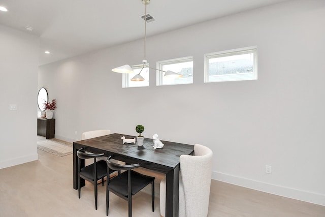 dining space featuring light hardwood / wood-style floors