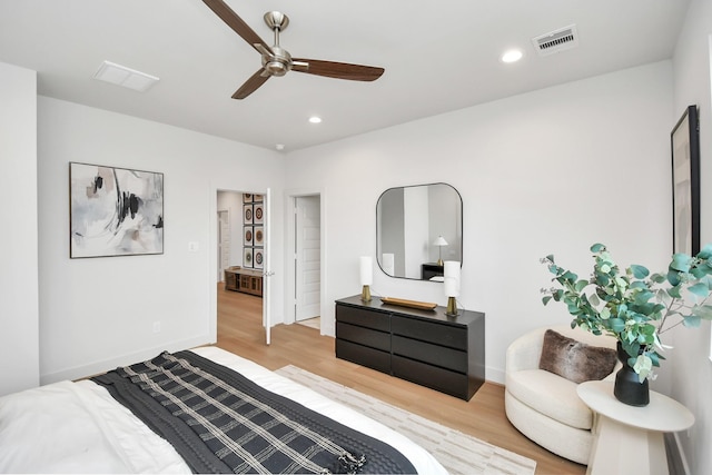 bedroom with ceiling fan and light hardwood / wood-style flooring