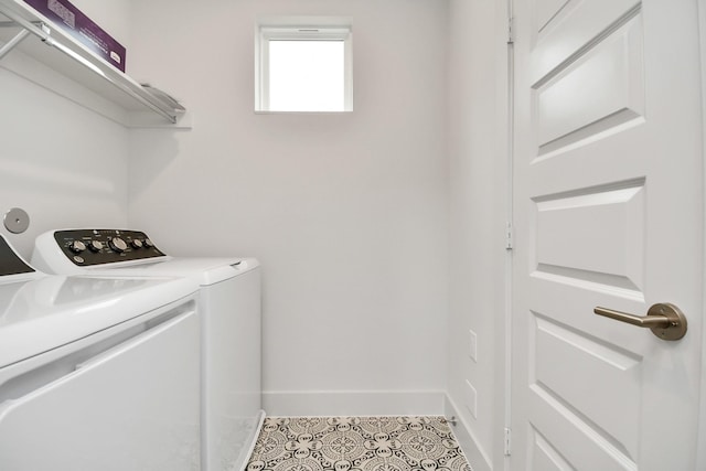 clothes washing area featuring light tile patterned floors and separate washer and dryer