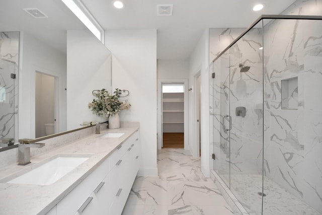 bathroom with vanity, toilet, and walk in shower