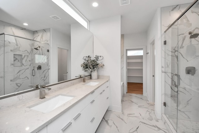 bathroom with vanity and walk in shower