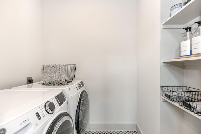 washroom with independent washer and dryer