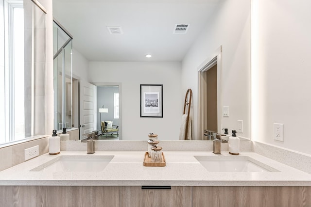 bathroom with vanity and walk in shower