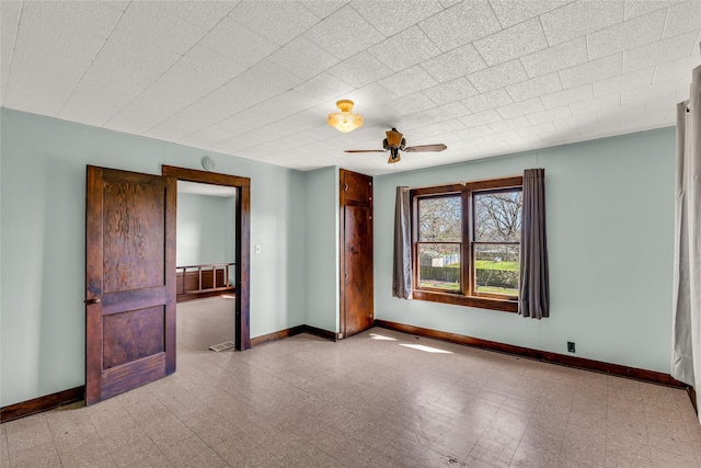 unfurnished room with ceiling fan