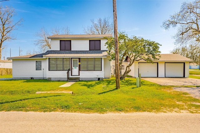 view of front of house with a garage and a front yard