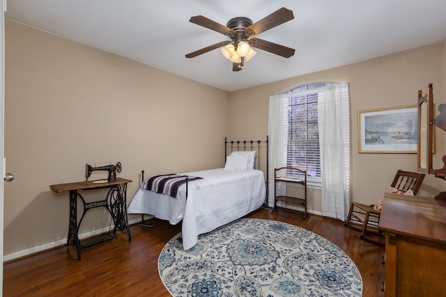 bedroom with ceiling fan and dark wood-type flooring