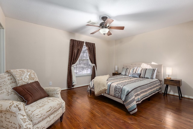 bedroom featuring ceiling fan and dark hardwood / wood-style floors