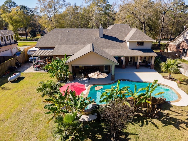 view of pool with an outdoor living space, a patio area, and a lawn