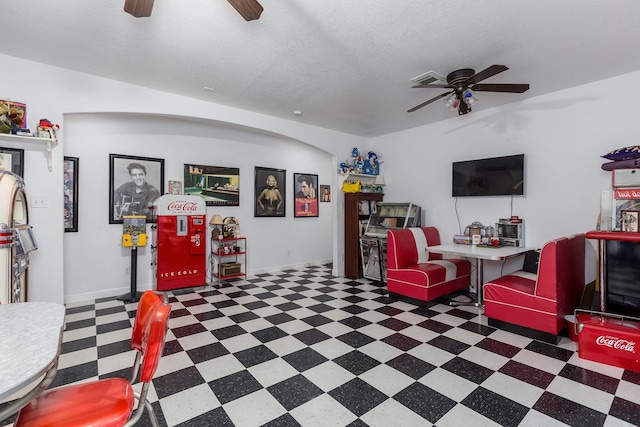 playroom with a textured ceiling