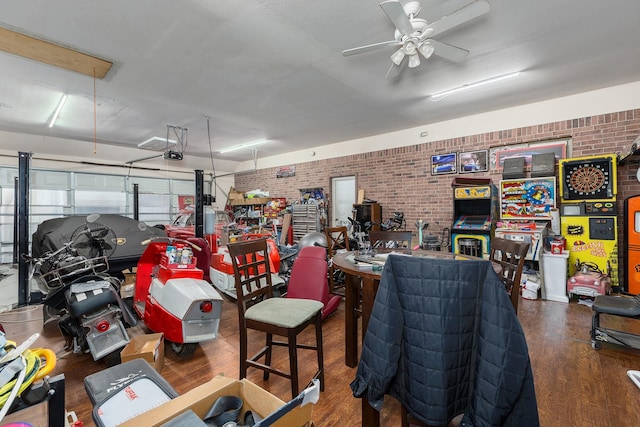 garage with ceiling fan and a garage door opener