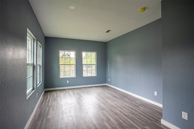 empty room featuring hardwood / wood-style flooring