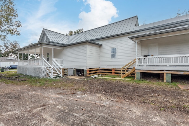 view of property exterior with a porch