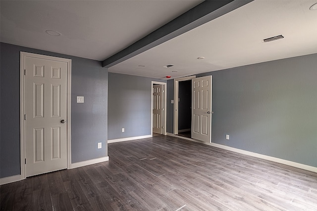 spare room featuring hardwood / wood-style floors