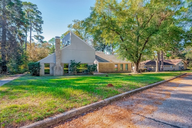 view of home's exterior with a lawn