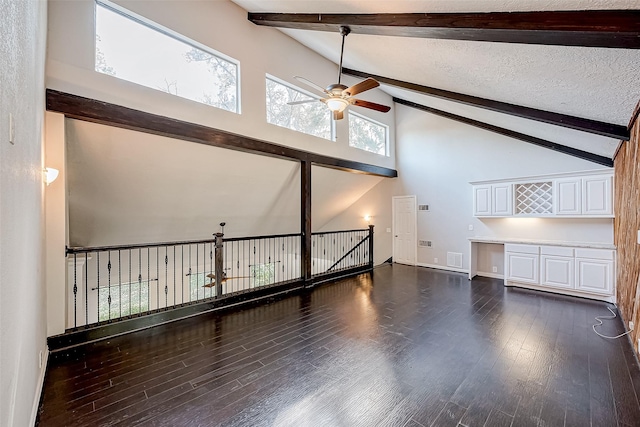 interior space featuring dark wood-type flooring, high vaulted ceiling, ceiling fan, a textured ceiling, and beamed ceiling